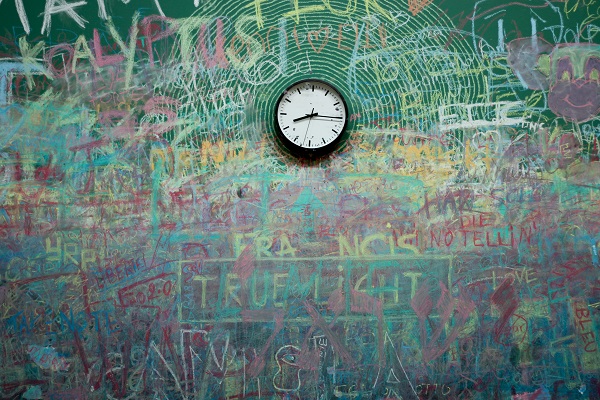Clock over graffiti background